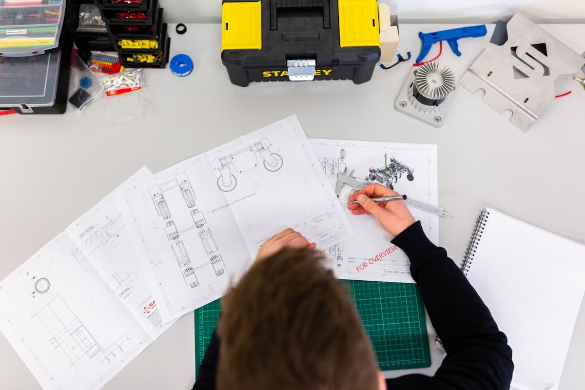 Electrical workshop bench — engineers testing solar and electronics hardware